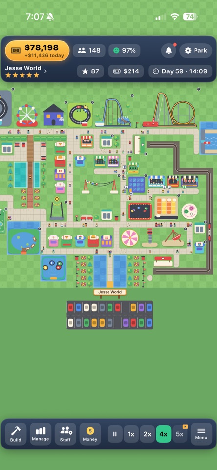 An overhead view of a colourful Wonder Lot theme park, with rides, paths and guests